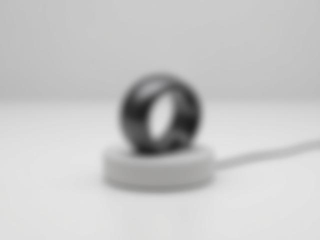 Sleek Oura Ring on a charging stand.